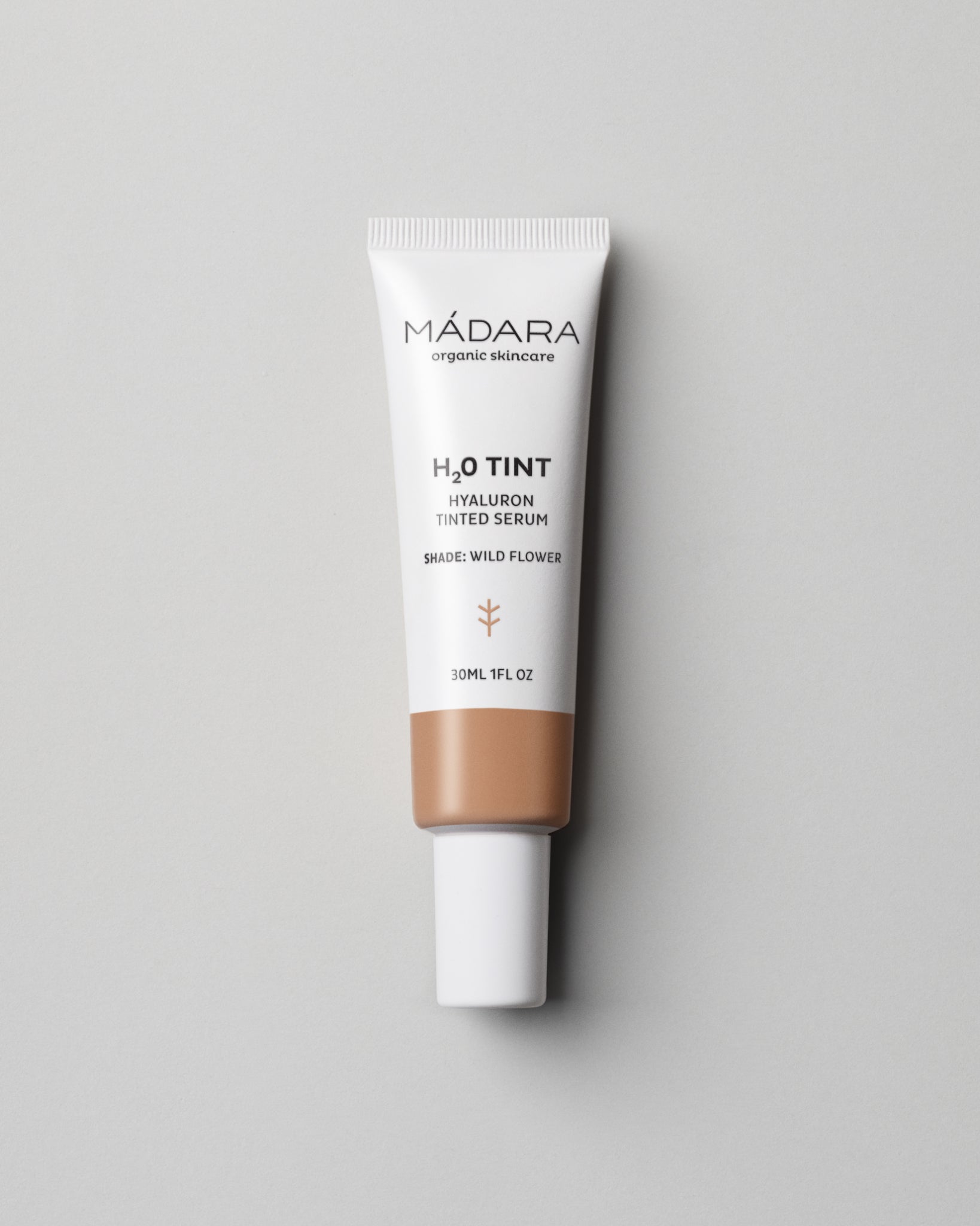 MÁDARA Organic Skincare hyaluron tinted serum wild flower A3514 serum product photo on plain background.