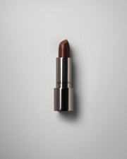 MÁDARA Organic Skincare dazzle nights lipstick dominance A6504 product photo on plain background.