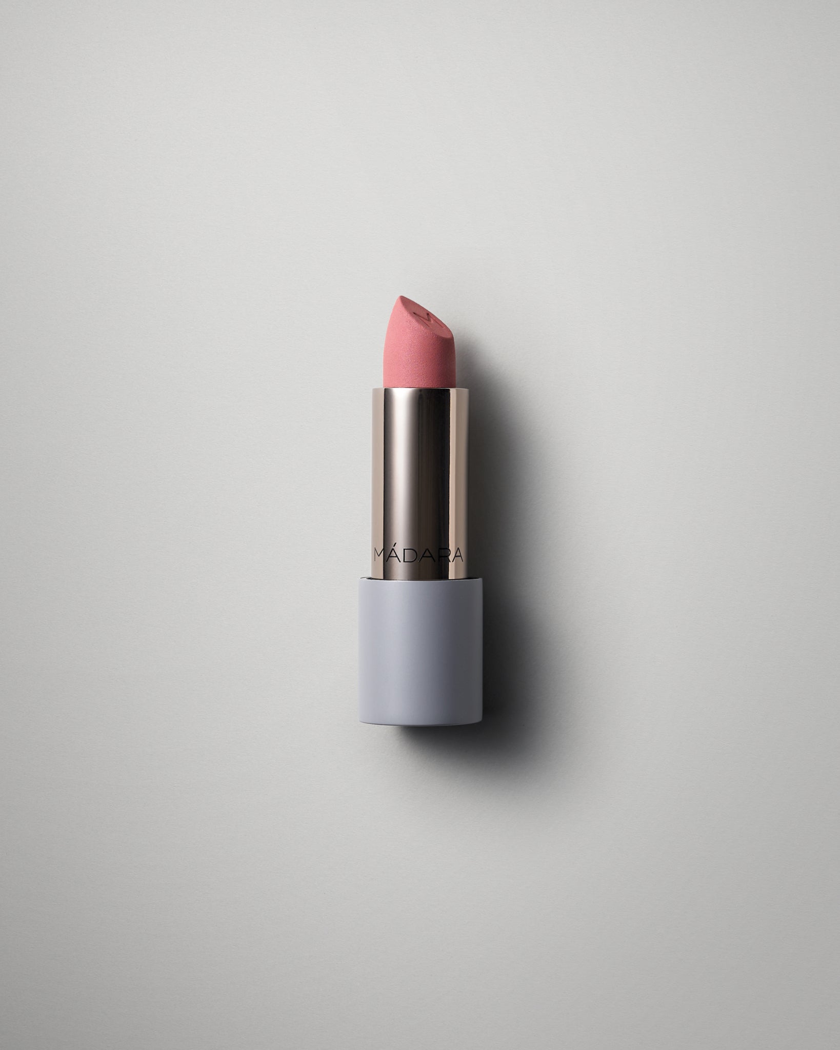 MÁDARA Organic Skincare matte cream lipstick cool nude A6301 face cream product photo on plain background.