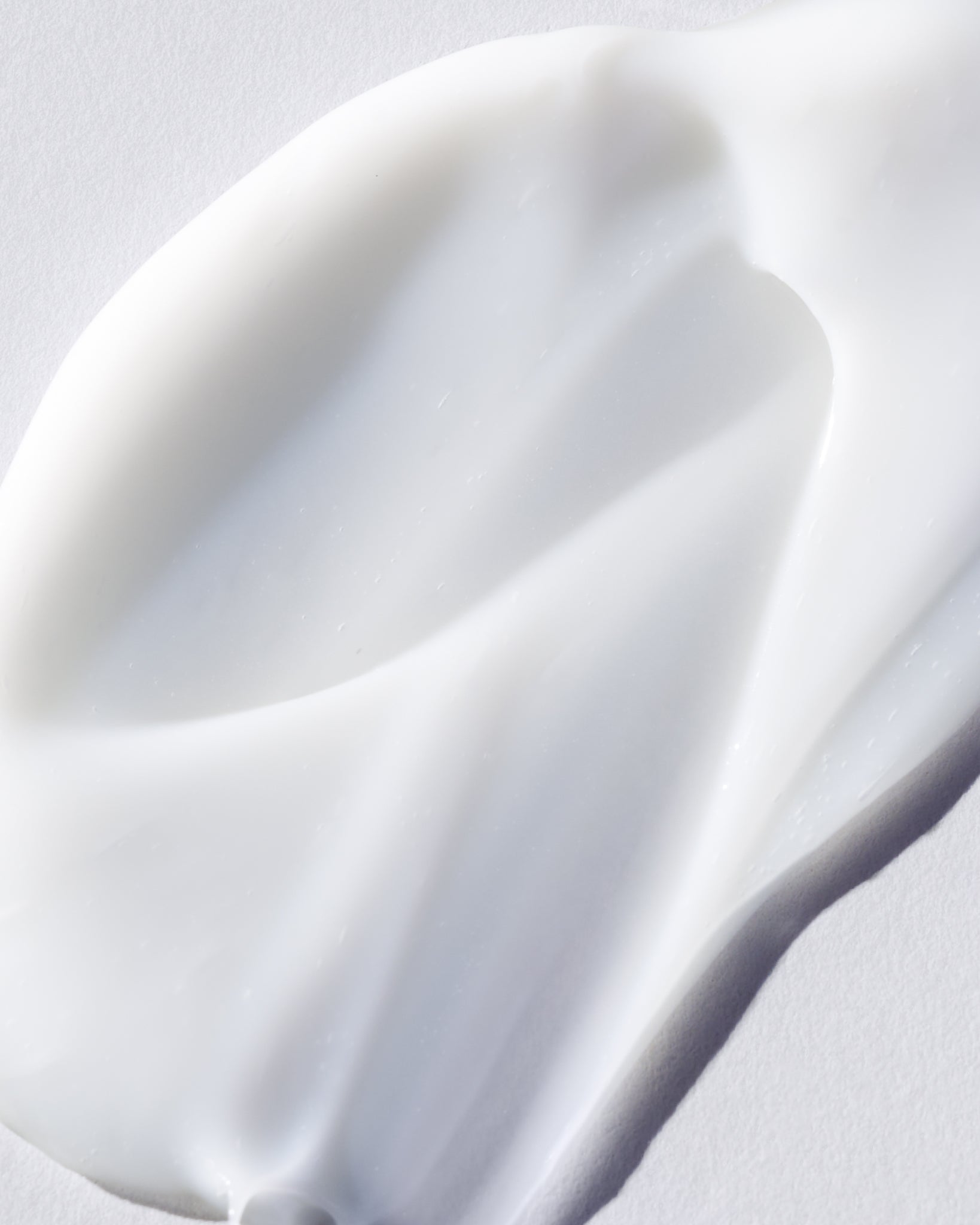 Texture close-up of MÁDARA Organic Skincare plant based retinol eye serum A3365 serum �swatch demonstrates consistency and finish.