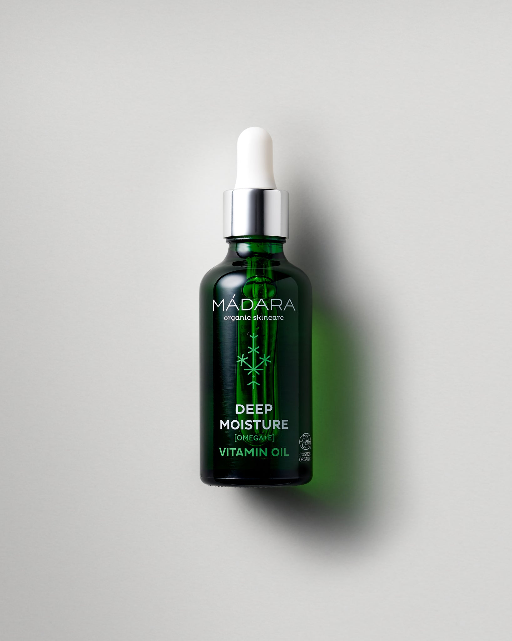 MÁDARA Organic Skincare deep moisture vitamin oil A2281 face oil product photo on plain background.