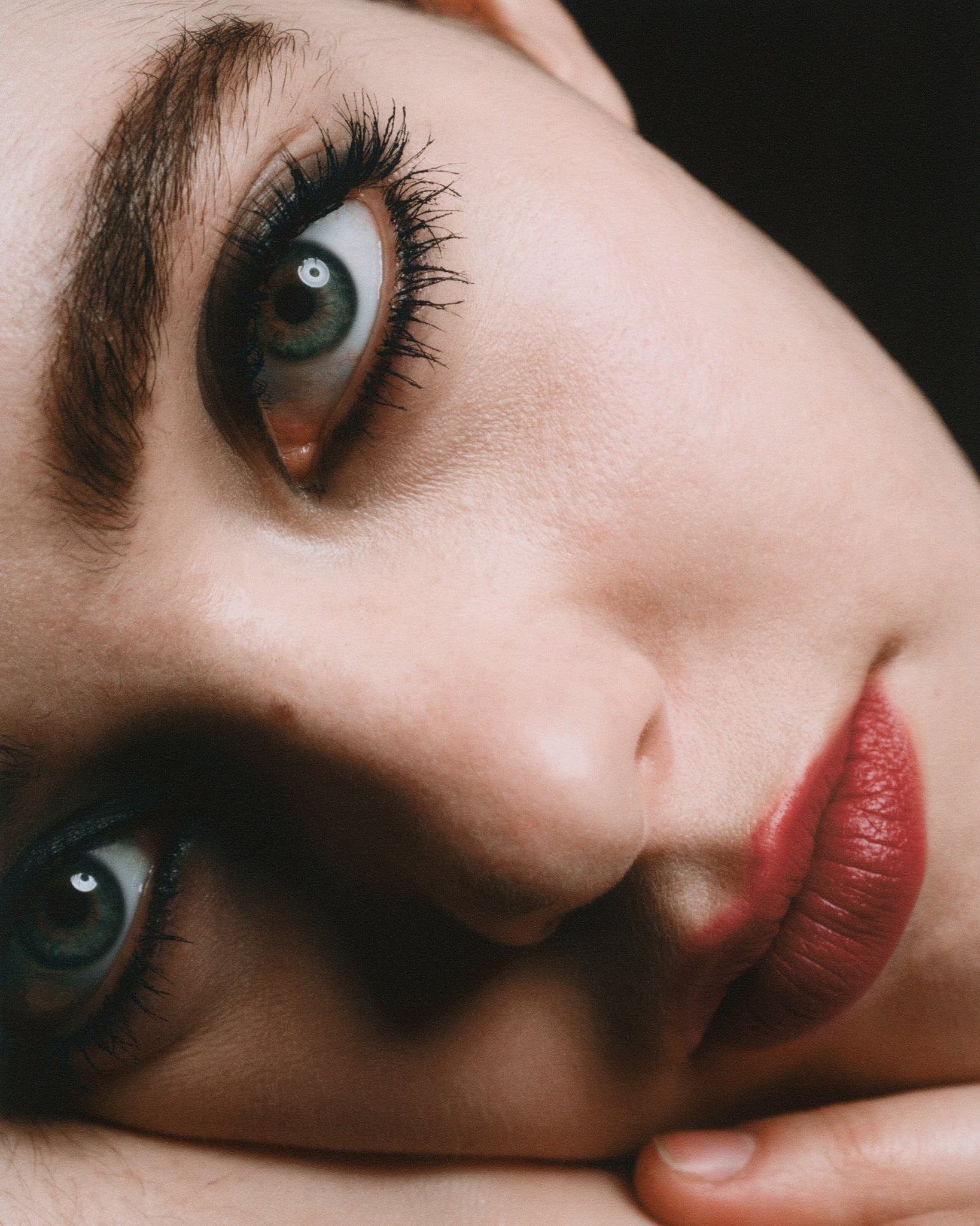 Model wearing MÁDARA Organic Skincare black eye pencil on A6881 eye contour care on skin; close-up portrait shows natural application results.