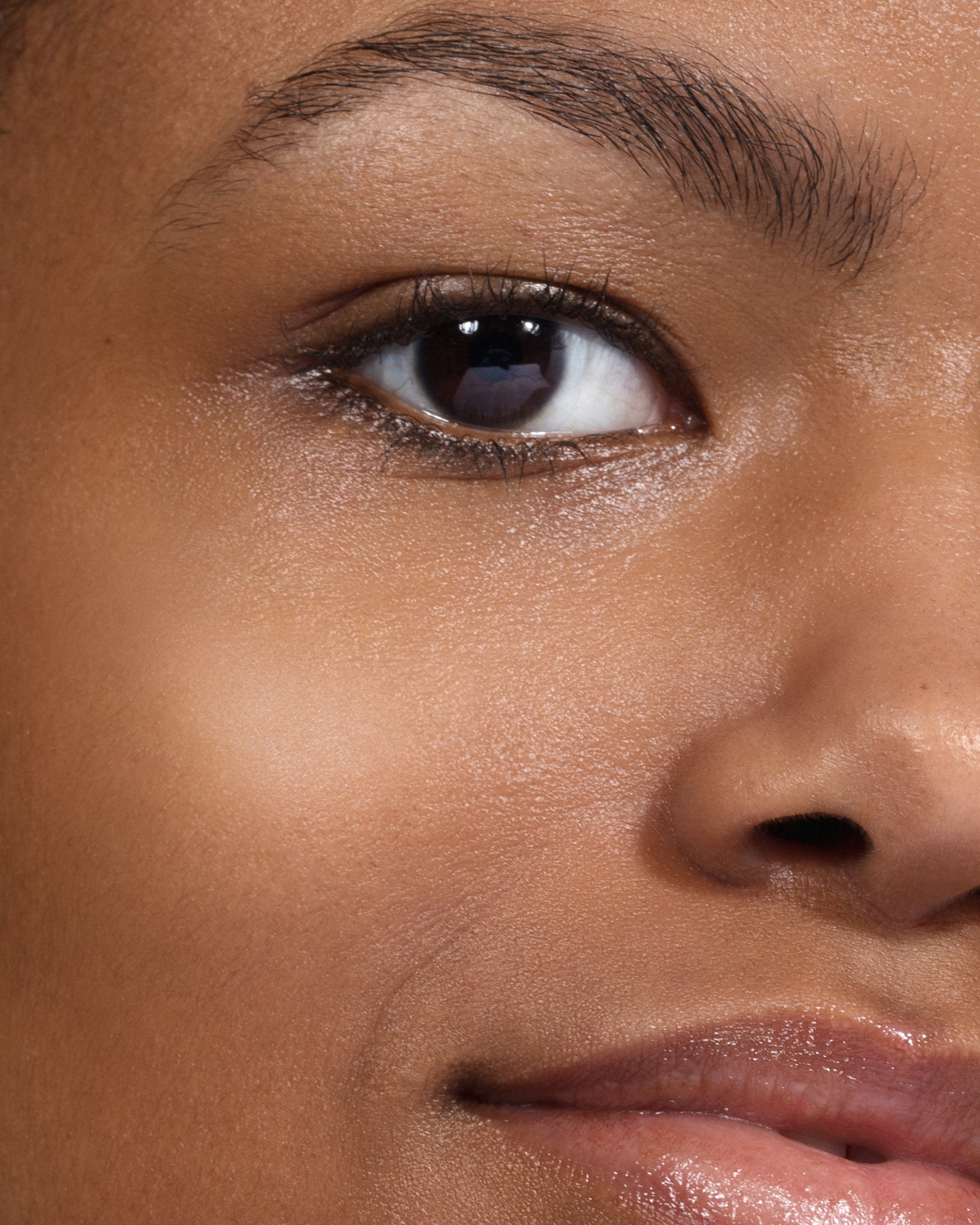 Model wearing MÁDARA Organic Skincare the concealer rich soil on A6116 concealer on skin; close-up portrait shows natural application results.