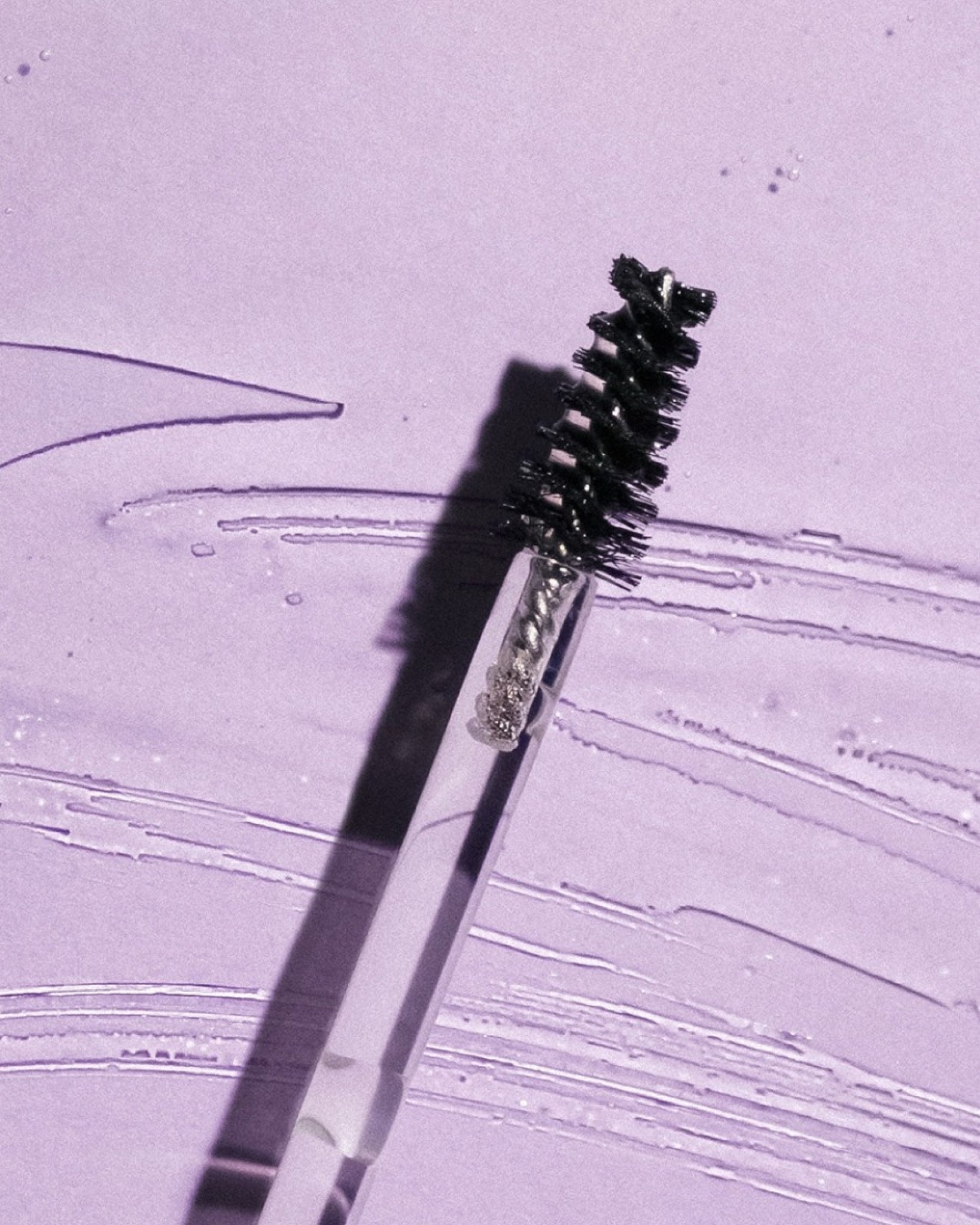 Texture close-up of MÁDARA Organic Skincare lash boost serum A6701 serum �swatch demonstrates consistency and finish.