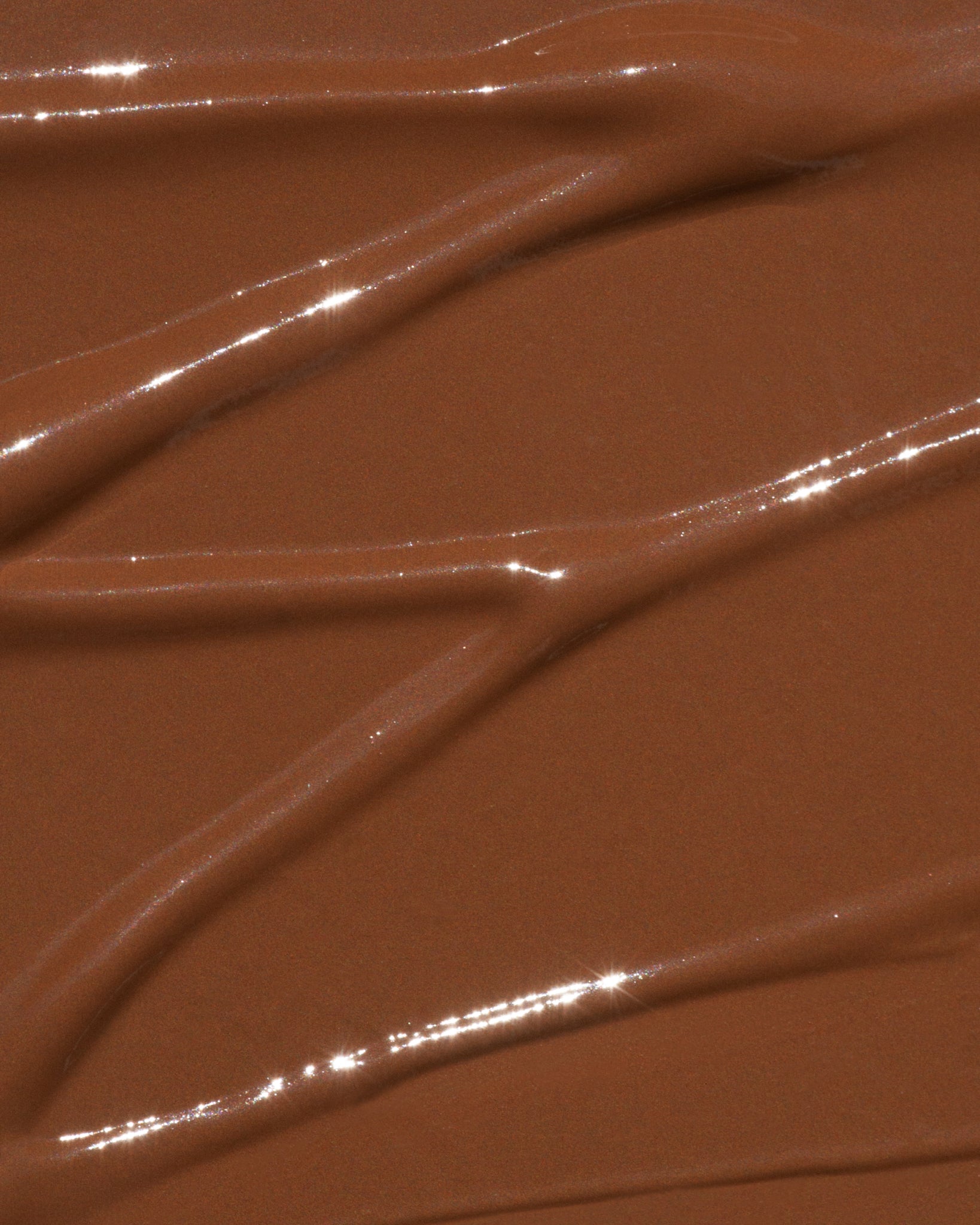 Texture close-up of MÁDARA Organic Skincare the concealer mocha A6105 concealer �swatch demonstrates consistency and finish.