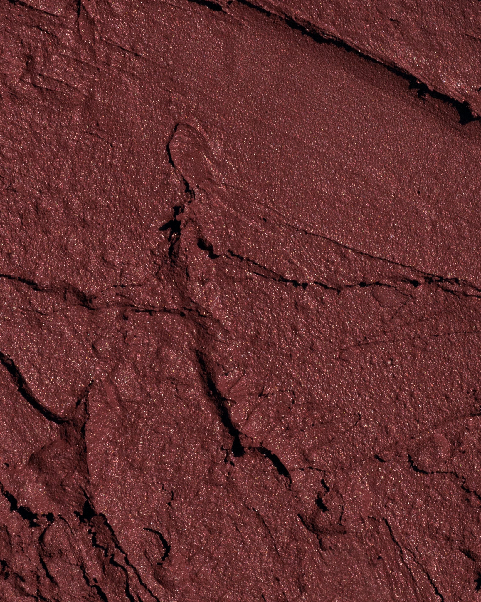 Texture close-up of MÁDARA Organic Skincare velvet wear dark nude A6305 �swatch demonstrates consistency and finish.
